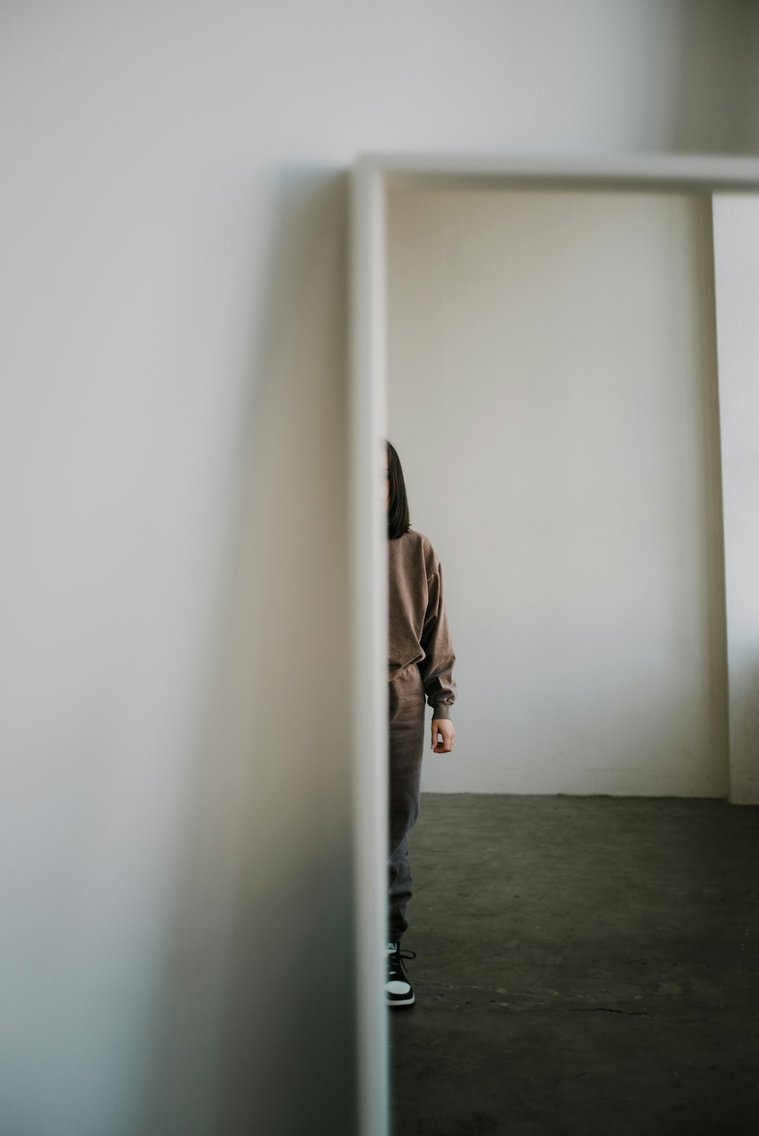 person reflecting in mirror