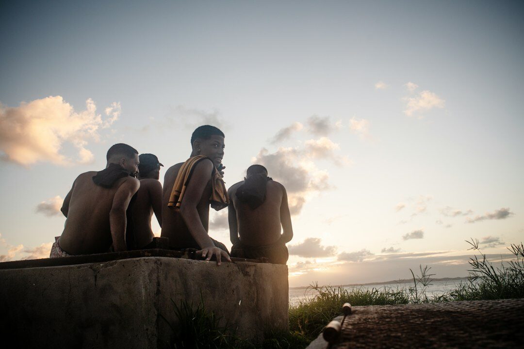 Small group of Brazilian friends having a supportive conversation outdoors