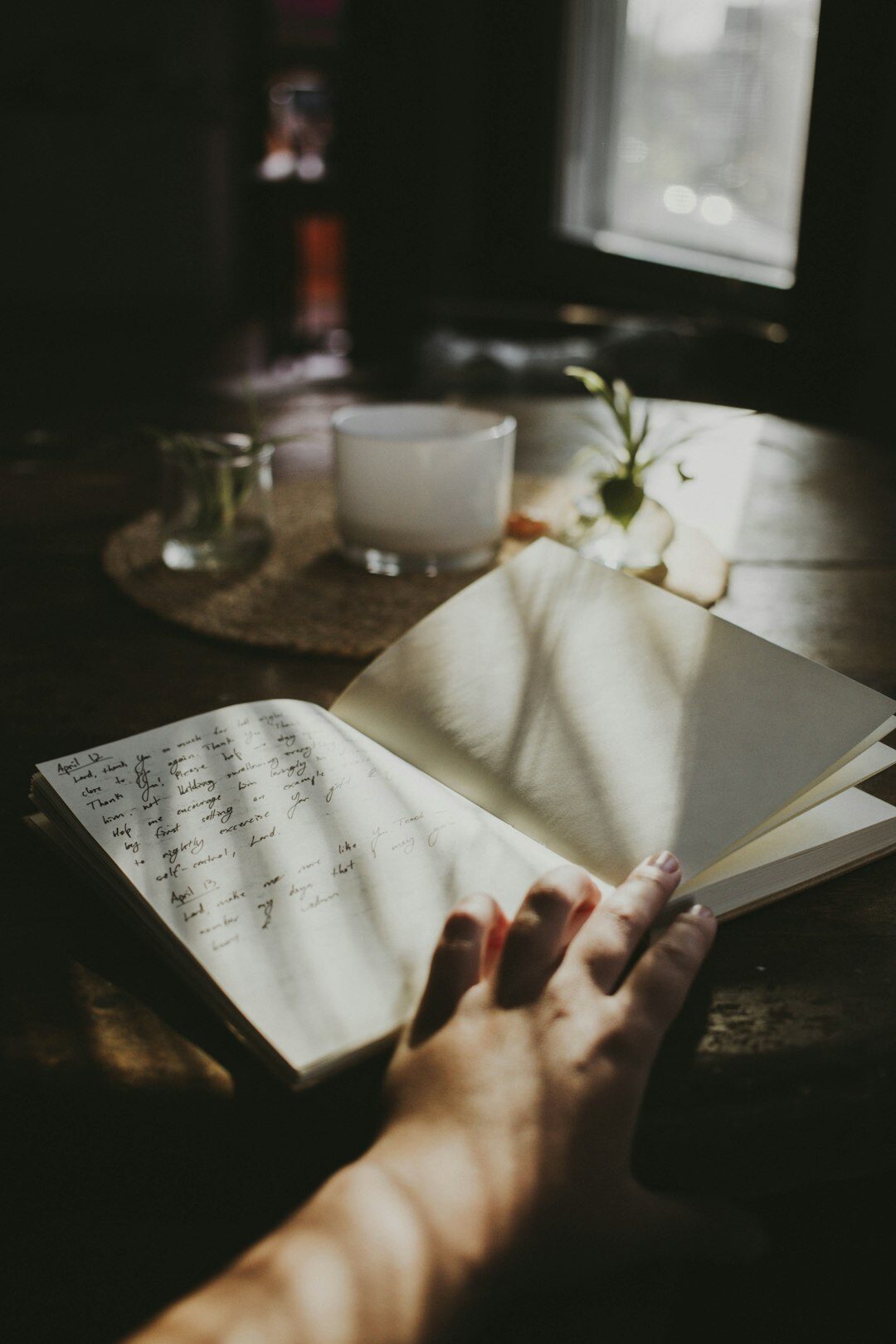 person writing in journal