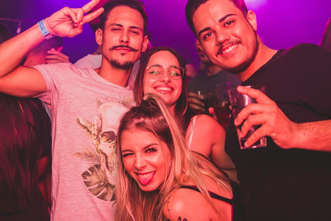 Group of young Brazilian adults talking and laughing during a communication workshop
