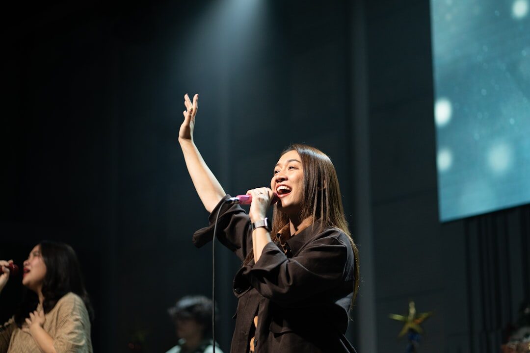 confident woman giving speech on stage